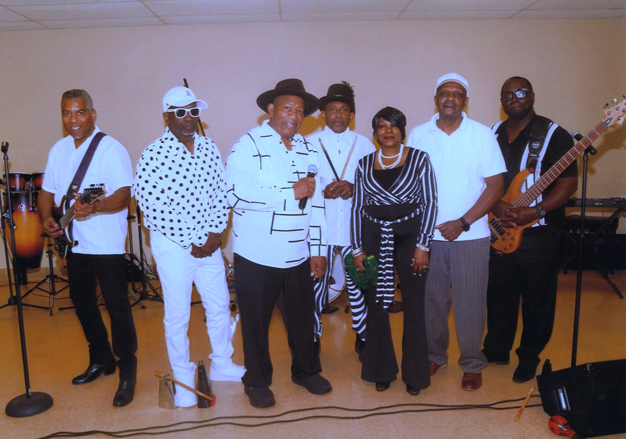 Cold Entrance band members posed together with their instruments